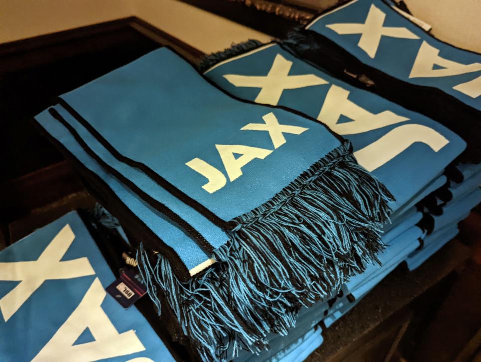JAXUSL scarves are displayed inside the TPC Sawgrass clubhouse before the club's August 2022 launch.