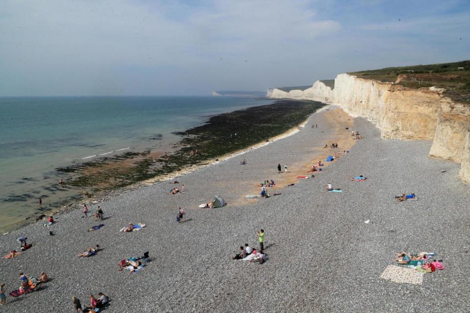 The father and his two sons were found at Birling Gap (PA )