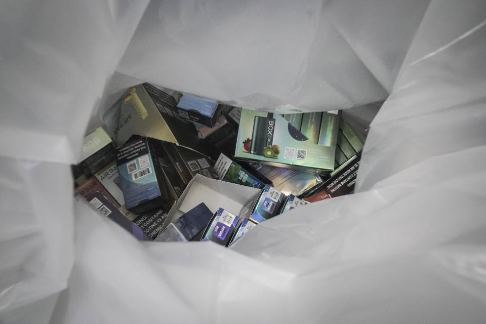 Vaping products are bagged and confiscated, during a spot raid of a tobacco store by members of New York Sheriff's Joint Compliance Task Force (SJCTF), Wednesday Sept. 27, 2023, in New York. Communities across the U.S. are confronting a new vaping problem: how to get rid of millions of disposable e-cigarettes that are considered hazardous waste. The devices contain nicotine, lithium and other materials that cannot be reused or recycled. (AP Photo/Bebeto Matthews)