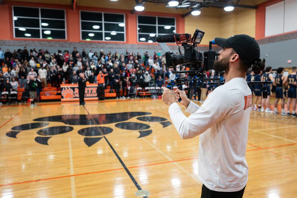 Angelo Padin, a North High graduate, films the crowd at the Polar Dome.