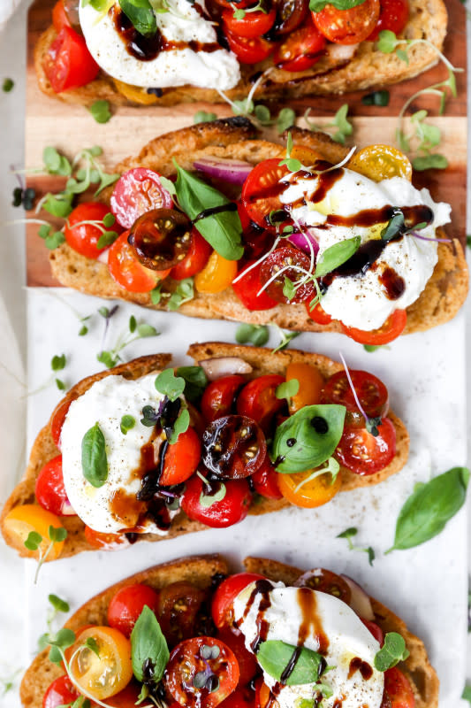 <p>Yes to Yolks</p><p>These burrata bruschetta toasts are so simple but look and taste incredibly luxurious.</p><p><strong>Get the recipe: <a href="http://yestoyolks.com/2020/06/10/burrata-bruschetta-toasts/" rel="nofollow noopener" target="_blank" data-ylk="slk:Burrata Bruschetta Toasts;elm:context_link;itc:0;sec:content-canvas" class="link "><em>Burrata Bruschetta Toasts</em></a></strong></p>