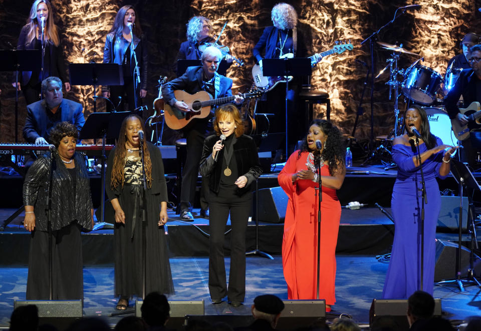 Reba McEntire, middle, performs with The McCrary Sisters during the 2019 Medallion Ceremony at the Country Music Hall of Fame and Museum on Sunday, Oct. 20, 2019 in Nashville, Tenn. (Photo by Sanford Myers/Invision/AP)