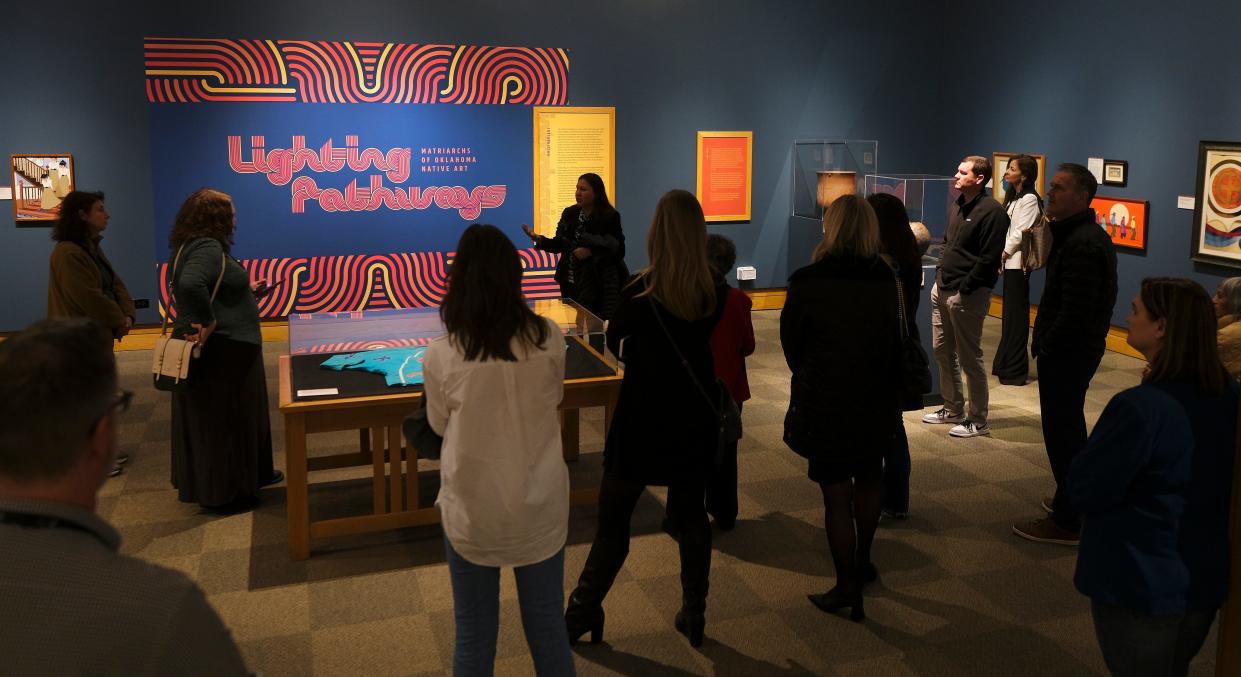 People look at the art in the National Cowboy & Western Heritage Museum's exhibition "Lighting Pathways: Matriarchs of Oklahoma Native Art."