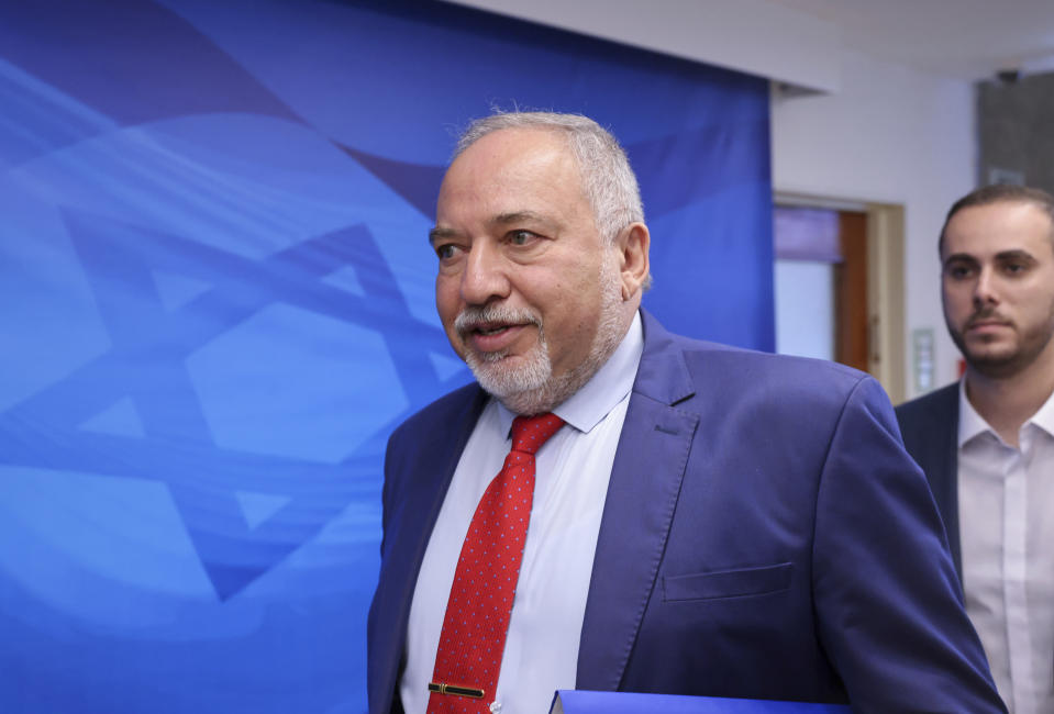 Israeli Finance Minister Avigdor Lieberman arrives for the first weekly cabinet meeting of the new government in Jerusalem, Sunday, June 20, 2021. Prime Minister Naftali Bennett opened his first Cabinet meeting on Sunday since swearing in his new coalition government with a condemnation of the newly elected Iranian president, whom he called “the hangman of Tehran.” (Emmanuel Dunand/Pool Photo via AP)