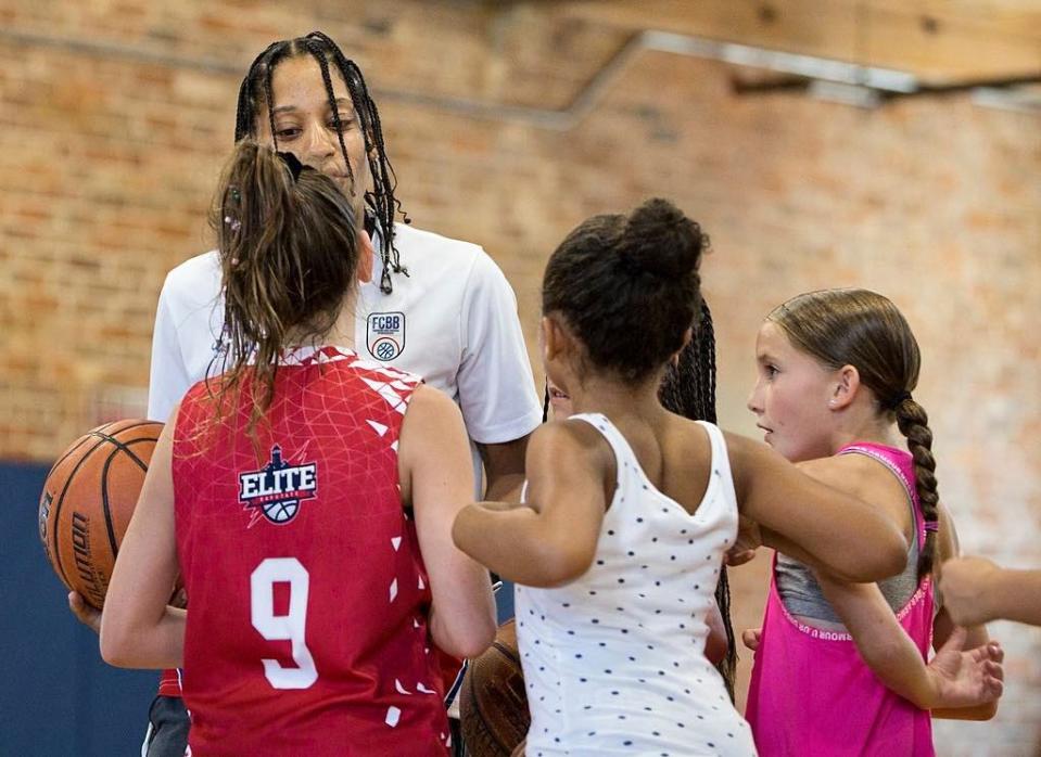 New Bedford's Allexia Barros talks to youth basketball players during an event to announce her clothing line, Lexicon, Athletic Wear That Inspires.