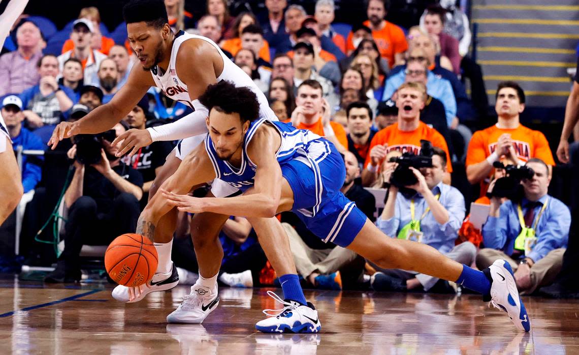 Duke’s Dereck Lively II (1) gets to the ball before Virginia’s Jayden Gardner (1) during the first half of Duke’s game against Virginia in the finals of the ACC Men’s Basketball Tournament in Greensboro, N.C., Saturday, March 11, 2023.