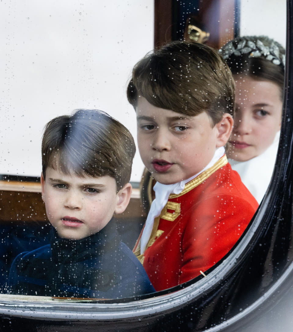 LONDON, ENGLAND - MAY 06: Prince Louis, Prince George and Princess Charlotte travel by carriage during the Coronation of King Charles III and Queen Camilla on May 06, 2023 in London, England. The Coronation of Charles III and his wife, Camilla, as King and Queen of the United Kingdom of Great Britain and Northern Ireland, and the other Commonwealth realms takes place at Westminster Abbey today. Charles acceded to the throne on 8 September 2022, upon the death of his mother, Elizabeth II. (Photo by Samir Hussein/WireImage)
