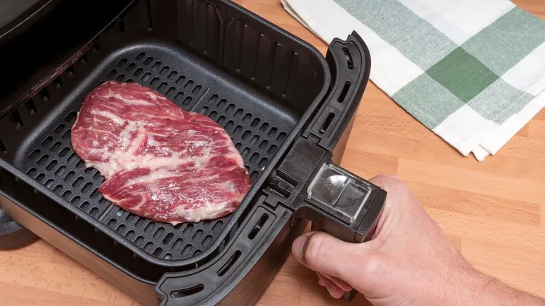 steak being cooked in air fryer