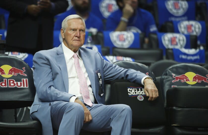 Jerry West sits on the bench before an NBA basketball game between the Los Angeles Clippers and the Phoenix Suns