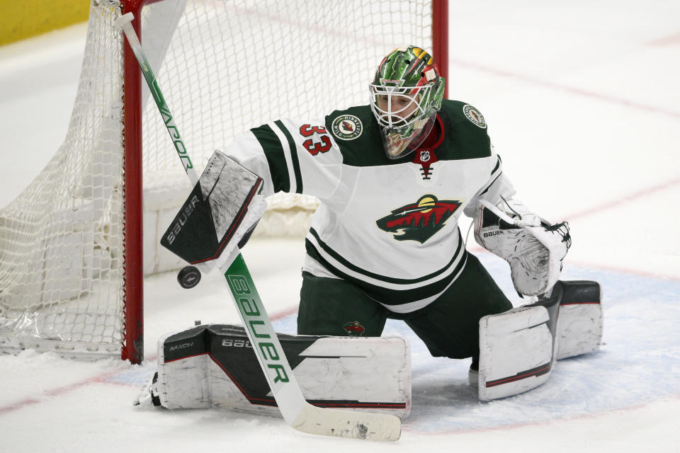 FILE - Minnesota Wild goaltender Cam Talbot deflects the puck during the third period of the team's NHL hockey game against the Washington Capitals, April 3, 2022, in Washington. The Wild have traded Talbot to the Ottawa Senators for fellow goaltender Filip Gustavsson. The move comes days after Minnesota re-signed veteran Marc-Andre Fleury and in the aftermath of Ottawa trading Matt Murray to Toronto. (AP Photo/Nick Wass, File)
