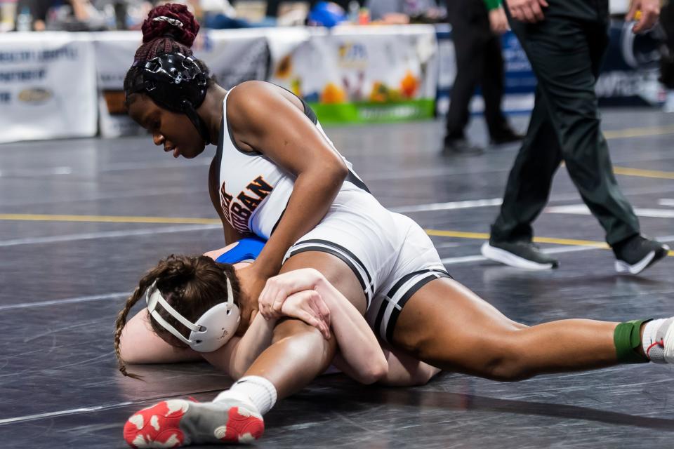 York Suburban's Angela Imorhoa (top) wrestles Canon-McMillan's Audrey Calgaro in a 170-pound quarterfinal round bout at the PIAA Class Girls' Wrestling Championships at the Giant Center on March 8, 2024, in Hershey. Calgaro won by fall at 2:24.