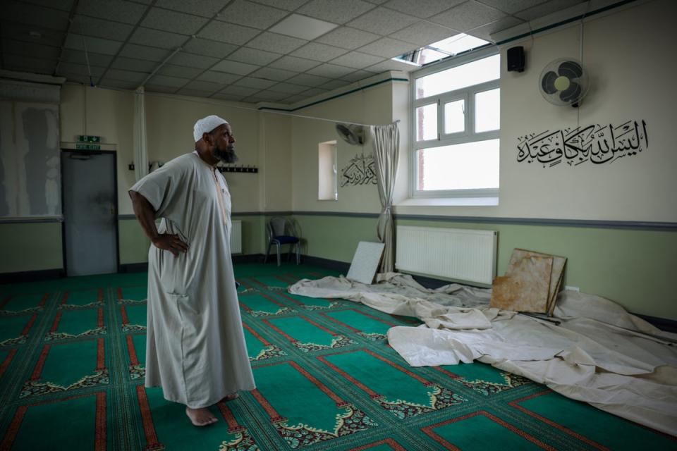 Imam Sheikh Ibrahim Hussein inspects the damage at the Southport Islamic Centre mosque following a protest (PA).