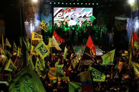 Ecuadorean presidential candidate Lenin Moreno (C on stage) and supporters celebrate in a hotel in Quito, Ecuador, April 2, 2017. REUTERS/Mariana Bazo