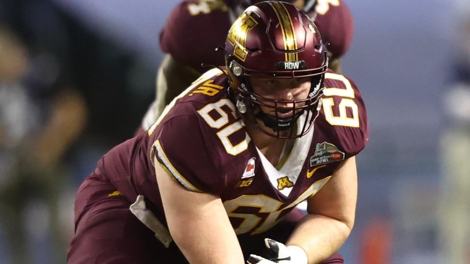Dec 28, 2021; Phoenix, AZ, USA; Minnesota Golden Gophers center John Michael Schmitz (60) against the West Virginia Mountaineers in the Guaranteed Rate Bowl at Chase Field