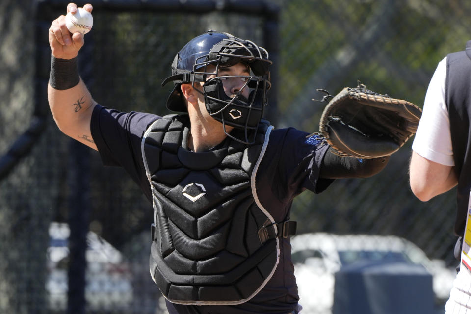 New York Yankees catcher Austin Wells throws to second base during a baseball spring training workout Wednesday, Feb. 21, 2024, in Tampa, Fla. (AP Photo/Charlie Neibergall)