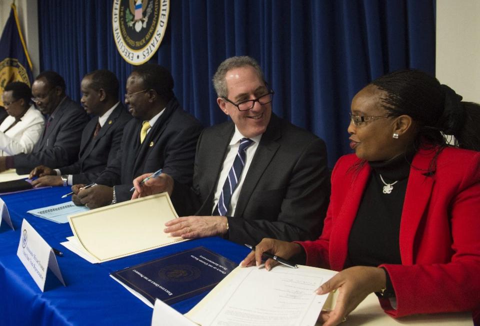 <span>US ambassador Michael Froman signs the East African Community–United States Cooperation Agreement on Trade Facilitation, Sanitary and Phytosanitary Measures, and Technical Barries to Trade, alongside representatives from the East African Community in Washington, 2015.</span> <span><span>Saul Loeb/AFP</span></span>