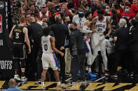 The Philadelphia 76ers and the Atlanta Hawks are separated after a brief scuffle during the second half of Game 6 of an NBA basketball Eastern Conference semifinal series Friday, June 18, 2021, in Atlanta. (AP Photo/John Bazemore)