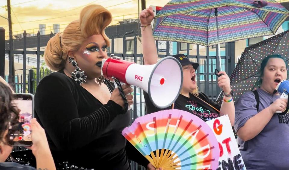 Kiba Walker in drag as Salem Moon addresses anti-drag protesters outside of Tulips on March 27, 2023.