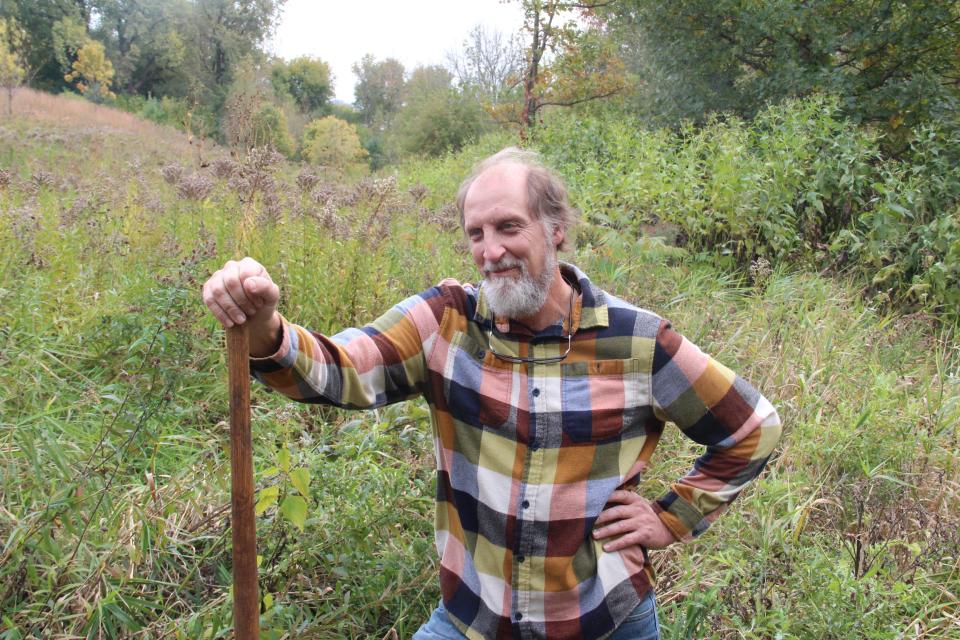 Ken Leinbach, who served as executive director of the Urban Ecology Center from 1998 to 2023, helps plant an oak tree Oct. 18 in the Rotary Centennial Arboretum at the UEC's Riverside Park campus.