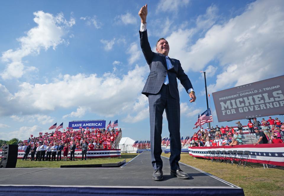 Republican candidate for governor Tim Michels appears on stage before he speaks as former President Donald Trump held a campaign rally for Michels at the Waukesha County Fairgrounds in Waukesha on Friday.