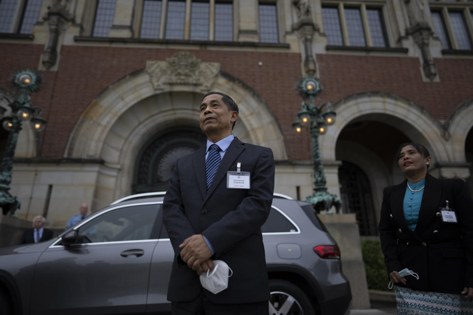 Myanmar's agent, Union Minister Ko Ko Hlaing comments outside the International Court of Justice in The Hague, Netherlands, Friday, July 22, 2022, where judges of the UN court dismissed Myanmar's preliminary objections, saying it has jurisdiction in Rohingya genocide case. (AP Photo/Peter Dejong)