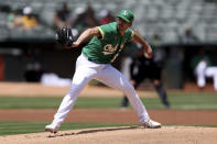 Oakland Athletics' Zach Logue pitches against the Texas Rangers during the first inning of a baseball game in Oakland, Calif., Saturday, May 28, 2022. (AP Photo/Jed Jacobsohn)