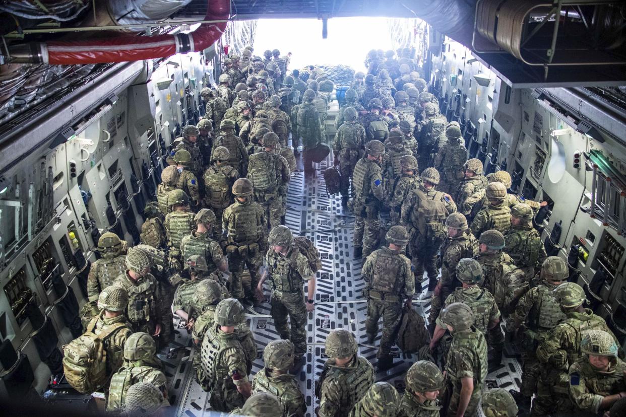 In this photo provided by the Ministry of Defence on Sunday, Aug. 15, 2021, members of the 16 Air Assault Brigade arrive in Kabul as part of a 600-strong UK force sent to assist with Operation PITTING to rescue British nationals in Afghanistan amidst the worsening security situation there.