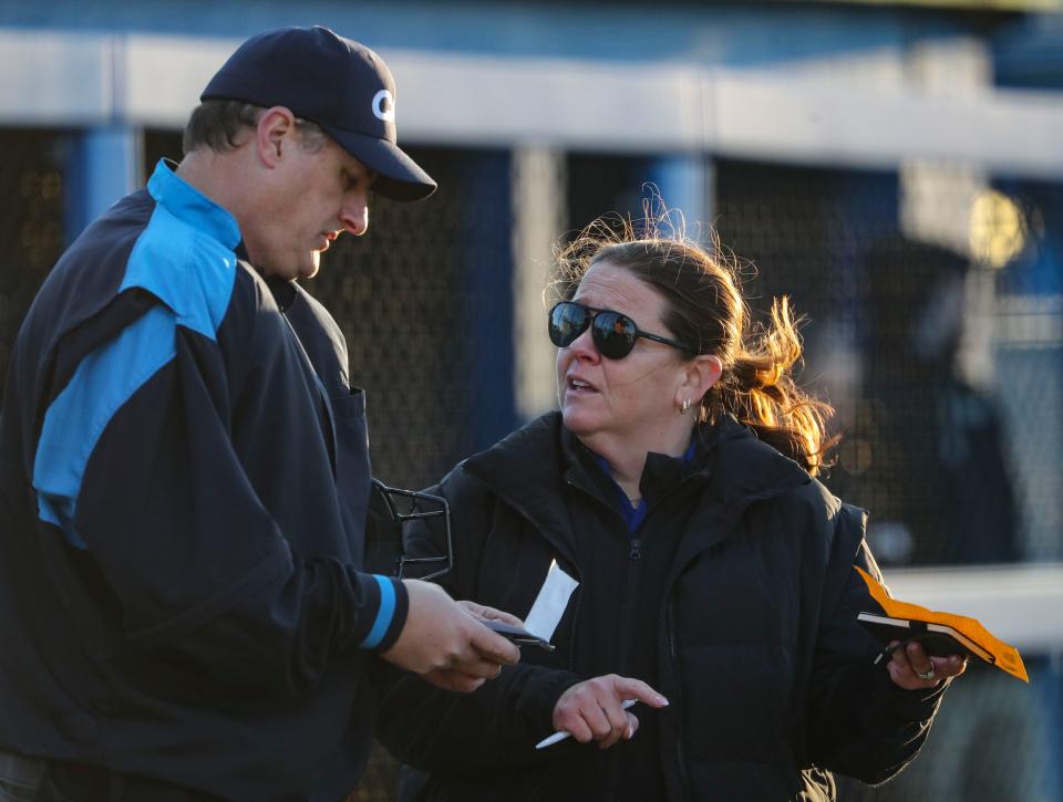 Delaware head coach Jen Steele confers with the home plate umpire in the fifth inning of the Blue Hens' 5-4 win, Friday, March 29, 2024 at the Delaware Softball Diamond.