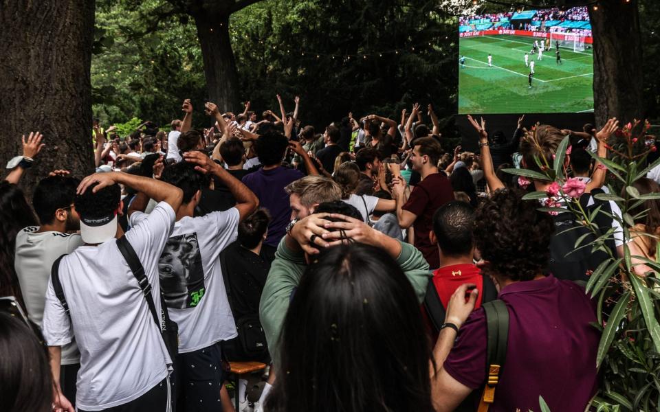 Crowds of German supporters vent their disappointment in a Berlin beer garden during the historic England match - FILIP SINGER/EPA-EFE/Shutterstock