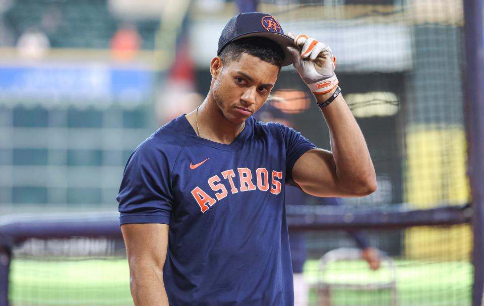 Astros shortstop Jeremy Peña takes a breather during batting practice before a game against the Texas Rangers in July.