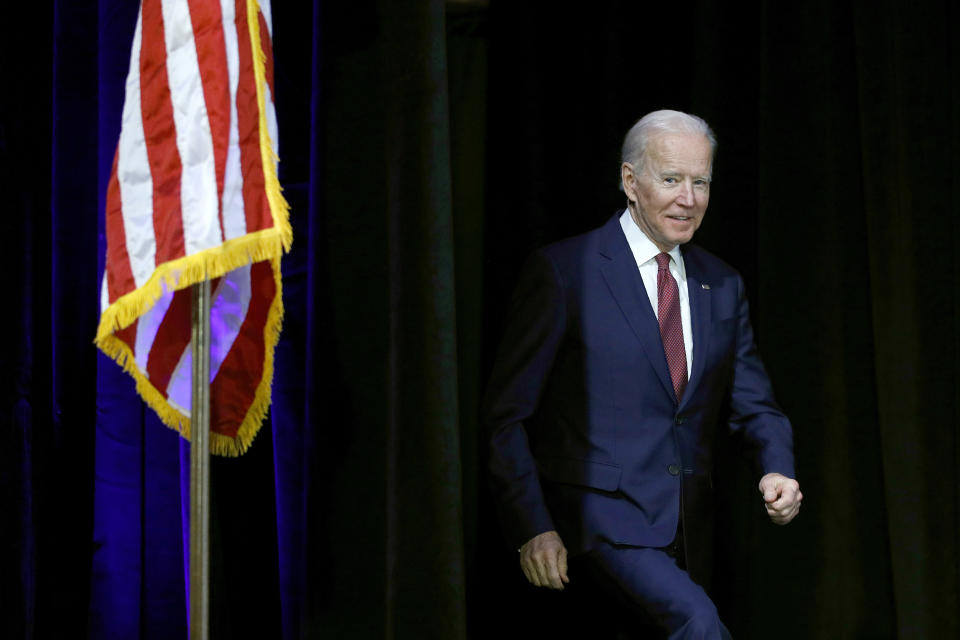 Democratic presidential candidate, former U.S. Vice President Joe Biden walks onstage to participate in a candidate forum on infrastructure at the University of Nevada, Las Vegas, Sunday, Feb. 16, 2020, in Las Vegas. (AP Photo/Patrick Semansky)