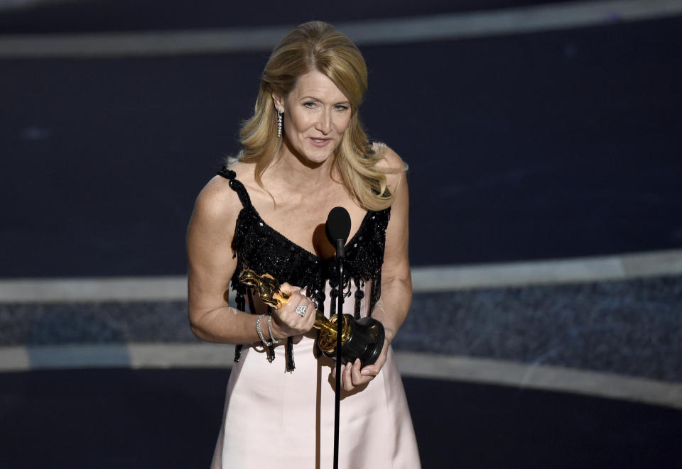 Laura Dern accepts the award for best performance by an actress in a supporting role for "Marriage Story" at the Oscars on Sunday, Feb. 9, 2020, at the Dolby Theatre in Los Angeles. (AP Photo/Chris Pizzello)