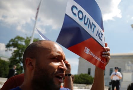 A protester holds sign outside the U.S. Supreme Court in Washington