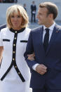 <p>French President Emmanuel Macron and his wife, Brigitte Macron, leave after the traditional Bastille Day military parade on the Champs-Élysées in Paris, France, Saturday, July 14, 2018. (Photo: Philippe Wojazer/Pool Photo via AP) </p>