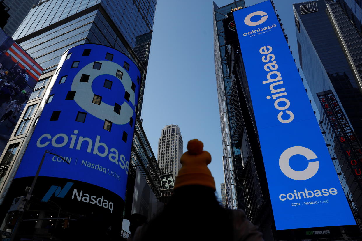 The logo for Coinbase Global Inc, the biggest U.S. cryptocurrency exchange, is displayed on the Nasdaq MarketSite jumbotron and others at Times Square in New York, U.S., April 14, 2021. REUTERS/Shannon Stapleton