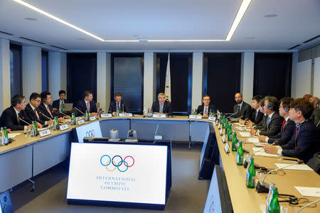 International Olympic Committee (IOC) President Thomas Bach, from Germany, speaks to North Korea's and South Korean delegations, during a meeting with the IOC for the bid to co-host the 2032 Summer Olympics, at the IOC Headquarters in Lausanne, Switzerland, Friday, February 15, 2019. Salvatore Di Nolfi/Pool via REUTERS