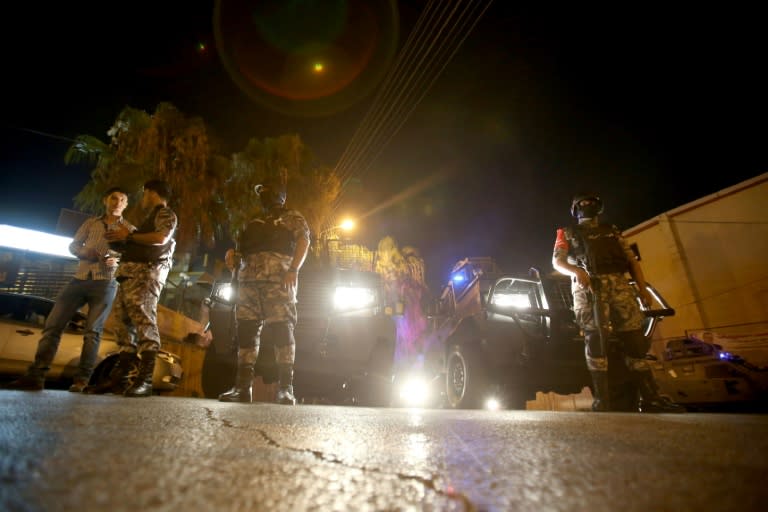 Security forces stand guard outside the Israeli embassy in Amman following an 'incident' on July 23, 2017 in which two Jordanians were killed