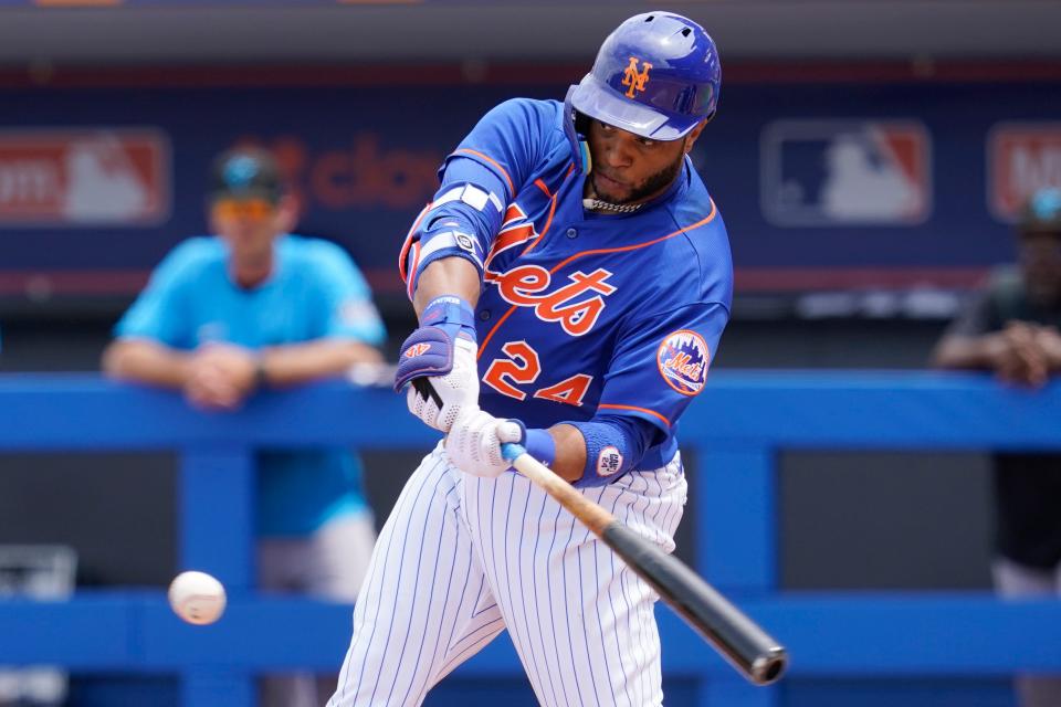 New York Mets' Robinson CanÃ³ (24) singles in the second inning of a spring training baseball game against the Miami Marlins, Sunday, April 3, 2022, in Port St. Lucie, Fla.