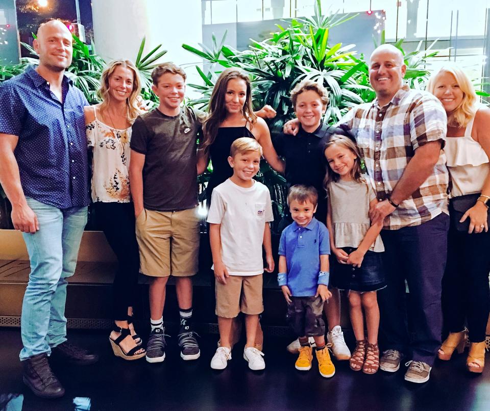 Matt Holliday, left, is pictured with his family, including brother Josh, second from right, who is the head coach at Oklahoma State. Matt, an MLB All-Star, is the volunteer assistant.