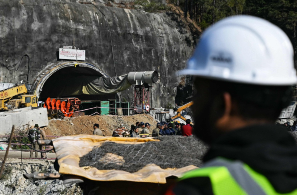 Rescue workers are busy trying to reach the trapped tunnel workers who will be medically evaluated by a team of doctors first and then brought out on stretchers after the operation is over (AP)
