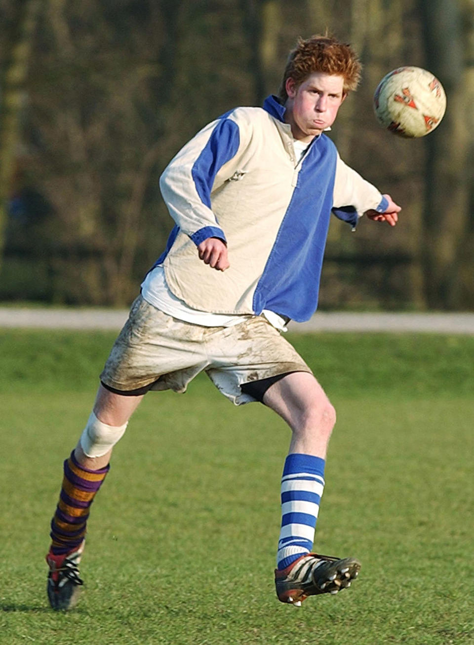 Prince Harry takes part in the field game against a team of "Old Boys" in March 2003 at Eton.