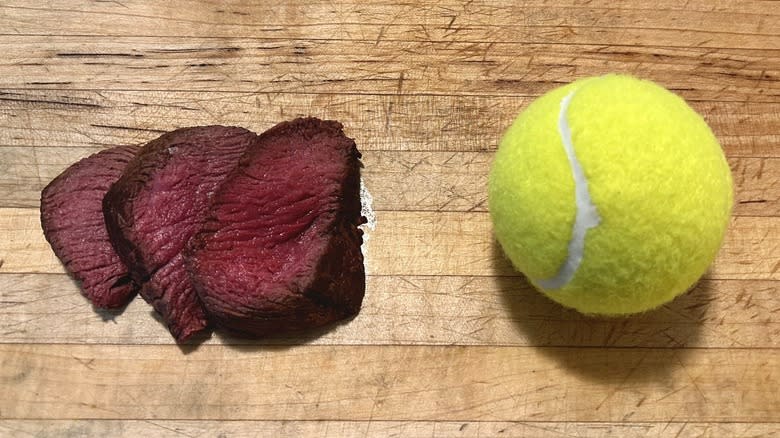 Filet mignon and tennis ball