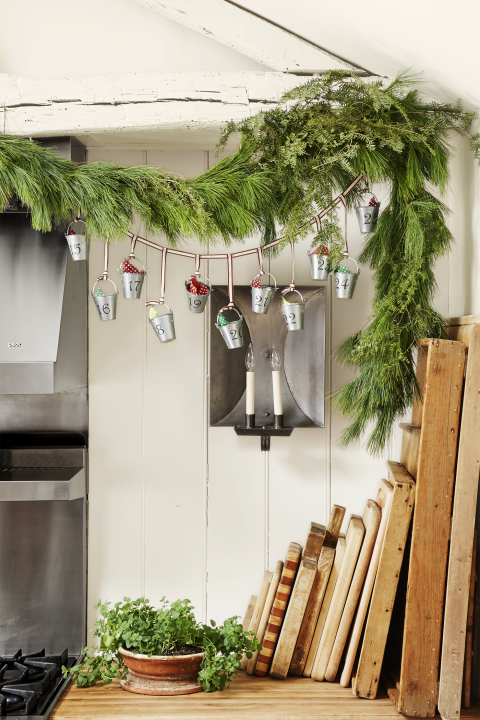 <p>Combine your advent calendar and holiday garland into one stunning display with this easy idea, which features mini galvanized pails as trinket holders. <br></p><p><a class="link rapid-noclick-resp" href="https://go.redirectingat.com?id=74968X1596630&url=http%3A%2F%2Fwww.orientaltrading.com%2Fmini-galvanized-metal-pails-a2-52_55.fltr&sref=https%3A%2F%2Fwww.elledecor.com%2Fdesign-decorate%2Fg38125716%2Ftop-diy-christmas-decorations%2F" rel="nofollow noopener" target="_blank" data-ylk="slk:SHOP MINI PAILS">SHOP MINI PAILS</a></p>