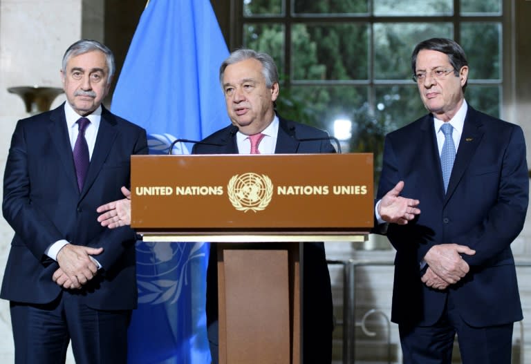 UN Secretary General Antonio Guterres (C) speaks as Turkish Cypriot leader Mustafa Akinci (L) and Greek Cypriot leader Nicos Anastasiades (R) listen on during a press conference following Cyprus peace talks in Geneva on January 12, 2017