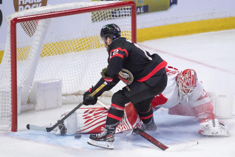Detroit Red Wings goalie Magnus Hellberg (45) makes a save on a shot from Ottawa Senators right wing Alex DeBrincat (12) in the third period at the Canadian Tire Centre in Ottawa, Ontario, on Monday, Feb. 27, 2023.