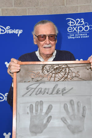 <p>The Marvel maestro shows off his plaque following his Disney Legend induction. (Photo: Disney) </p>