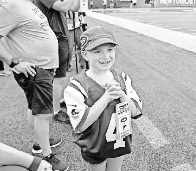 The Jets’ honorary captain for an Friday, Aug. 10, 2018, preseason game Grace Eline of Gillette watches her team take the field for pregame warm ups.