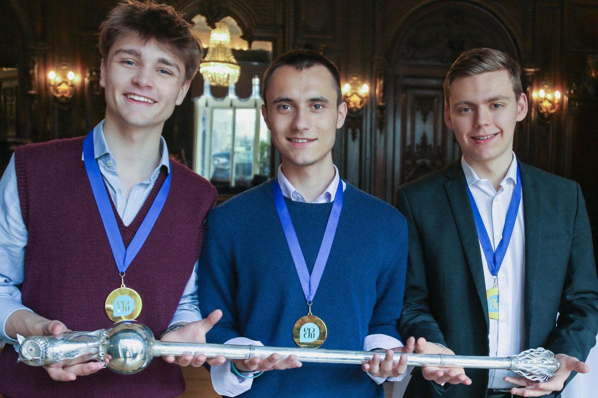 (L-R) Blake, Mustafa and Brayden, from Radley College, holding the English-Speaking Union mace. <i>(Image: Radley College)</i>