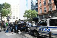 Police and media surround Kim Kardashian and Kanye West's town house in New York, on October 3, 2016