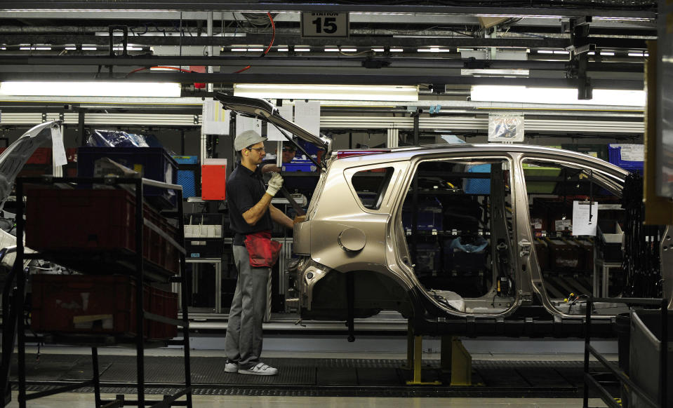 An employee works on the production line at the Nissan car factory in Washington, northern England. Photo: Nigel Roddis/Reuters